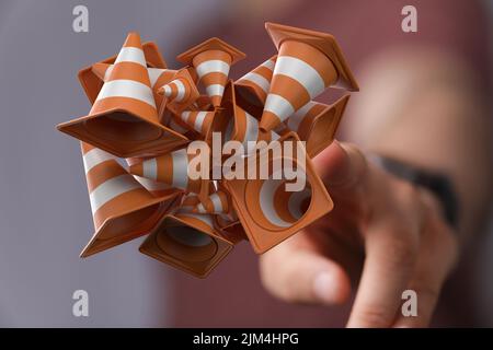 Eine Person, die die 3D Render von Verkehrskegeln im Bau Konzept präsentiert Stockfoto