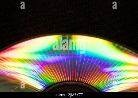 Lichtreflexion in einer Compact Disk (CD) oder Digital Versatile Disk (DVD). Alle Farben sind wie ein Regenbogen in der Scheibenoberfläche verstreut Stockfoto