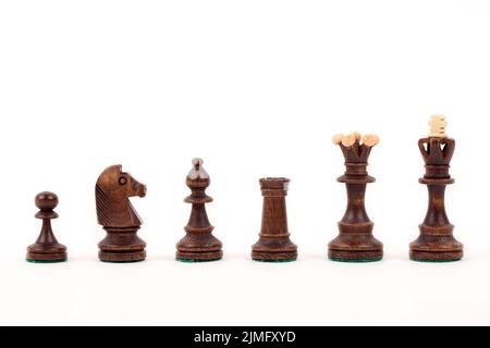 Schachfiguren auf dem weißen Hintergrund Stockfoto