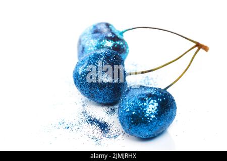 Kirschbeeren mit einem bunten glitzert bedeckt Stockfoto