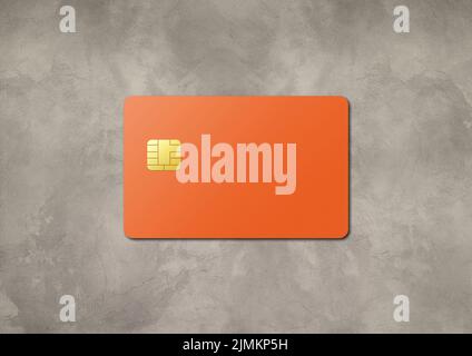 Orangefarbene Kreditkarte auf einem konkreten Hintergrund Stockfoto