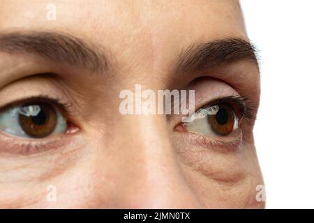 Müde Augen einer Frau mittleren Alters Stockfoto