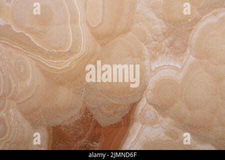 Honey Onyx Textur, Hintergrund in beige Farbe für stilvolles Interieur. Stockfoto