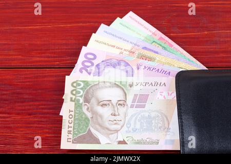 Ukrainische Geld in der schwarzen Mappe Stockfoto