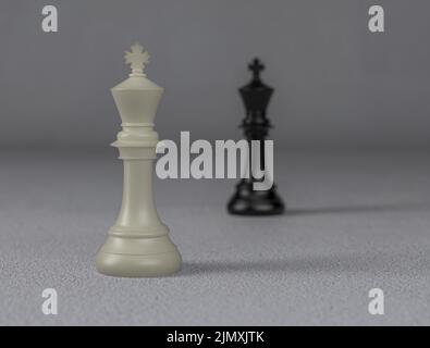 Weißer Schachkönig im Vordergrund und Fokus, schwarzer Schachkönig im unscharfen Hintergrund, 3D Illustration, Konzept des Unternehmenswettbewerbs Stockfoto