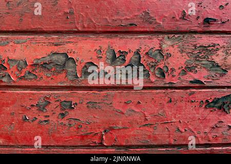 Rustikaler Hintergrund mit gealtertem rot lackiertem Holz Textur Stockfoto