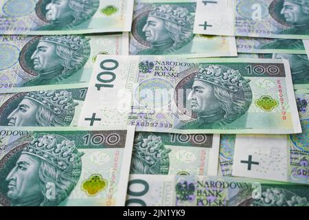 Hintergrund aus dem Geld. Polnische Banknoten. 100 Zloty Bargeld Stockfoto