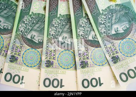 Hintergrund aus dem Geld. Polnische Banknoten. 100 Zloty Stockfoto