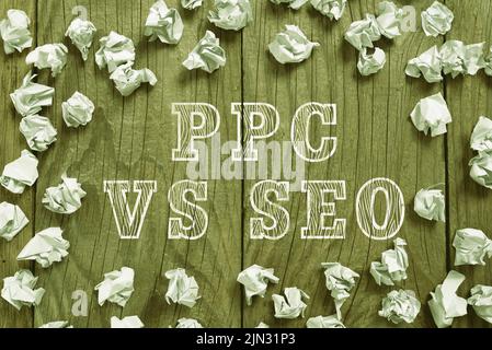 Schreiben mit Text PPC vs Seo. Business Approach Pay per click Against Search Engine Optimization Strategies Paper Wraps arranged in Circle with Stockfoto