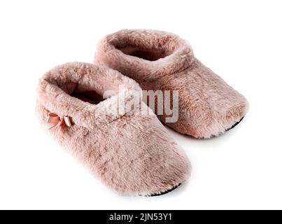 Rosa Hausschuhe vor weißem Hintergrund Stockfoto