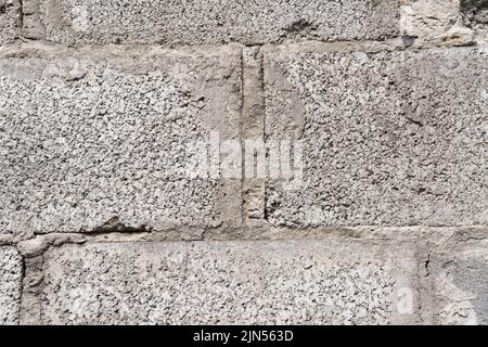 Vintage grauen Backstein Hintergrund, Nahaufnahme. Abstrakte geometrische Muster Textur, Outdoor-Baustein Wand, kann als Hintergrund für die Anzeige oder mon verwendet werden Stockfoto