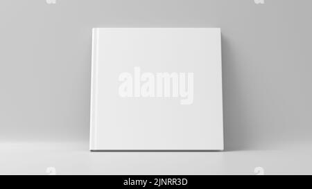 Leeres quadratisches Hardcover-Buchcover-Modell, das auf weißem Hintergrund steht. 3D Rendern Stockfoto