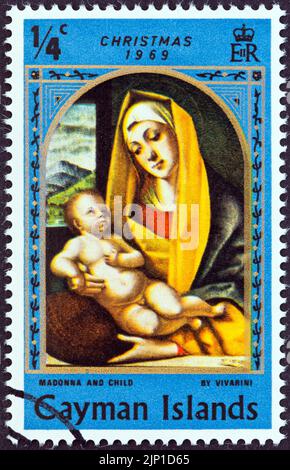 CAYMAN-INSELN - UM 1969: Eine auf den Cayman-Inseln gedruckte Marke aus der Weihnachts-Ausgabe zeigt Madonna und Kind von Vivarini, um 1969. Stockfoto