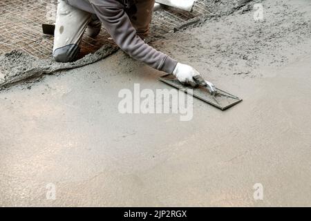 Bauarbeiter, Beton, Hobeln, blauer Kragen, Baumeister, Bauarbeiter, Bauarbeiter, Arbeiter, betoniert, arrangieren, Planung, Projekt, Projekte Stockfoto