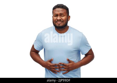 unglückliche Mann leidet unter Magenschmerzen Stockfoto