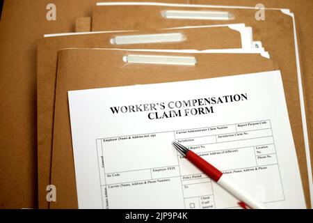 Workers Compensation Claim Form auf Dateien Beschwerde für Arbeitsunfälle Stockfoto