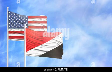 Winkende amerikanische Flagge und Flagge von Sealand, Fürstentum. Stockfoto