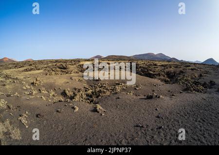 Typische Vulkanlandschaft im Gebiet der Caldera de Los Cuervos. Lanzarote, Kanarische Inseln. Spanien. Stockfoto