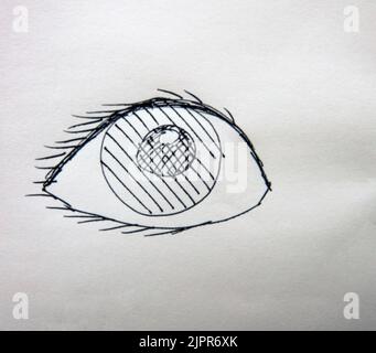 Doodle-Zeichnung eines Auges mit schwarzer Tinte auf weißem Papier Stockfoto