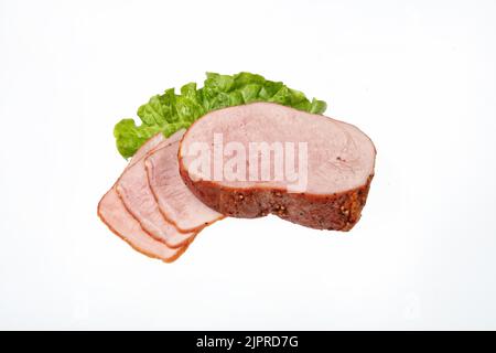 Geräuchertes Rindfleisch und Grün auf einem isolierten studio Hintergrund Stockfoto