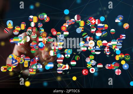 Die Hand eines Mannes mit illustrierten internationalen Flaggen-Ikonen Stockfoto