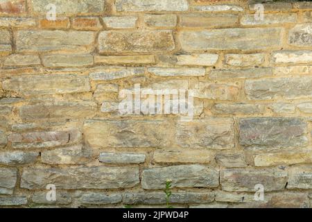 Alte graue Steinmauer. Steinhintergrund aus grauen alten Steinen. Stockfoto