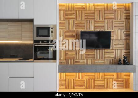 Großer Fernseher, der an der Wand im Wohnzimmer in einer modernen Einrichtung hängt Stockfoto
