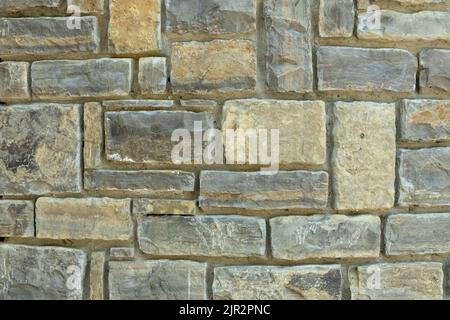 Die Textur der Steinmauer. Steinmauer als Hintergrund oder Textur. Teil der Steinwand für Hintergrund oder Textur Stockfoto