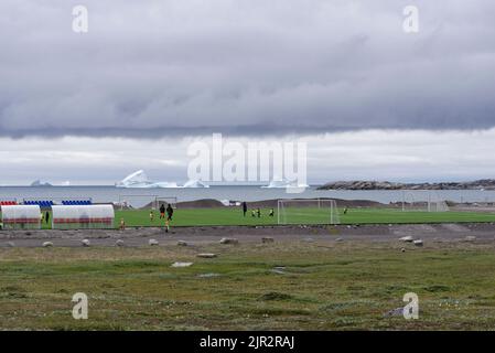 Kinder und Artic Soccer Stockfoto