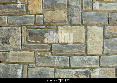 Die Textur der Steinmauer. Steinmauer als Hintergrund oder Textur. Teil der Steinwand für Hintergrund oder Textur Stockfoto