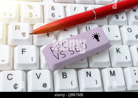 Handschriftenschild PPC vs Seo. Konzept Bedeutung Pay per click gegen Suchmaschinen-Optimierungsstrategien -49110 Stockfoto