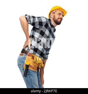 Männlicher Arbeiter oder Baumeister mit Rückenschmerzen Stockfoto