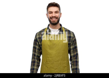 Glücklicher junger Gärtner oder Bauer im Vorfeld Stockfoto