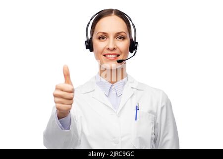 Lächelnde Ärztin mit Headset Stockfoto
