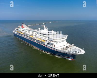 Cruise vessel Balmoral maiden call in Liepaja during Baltic sea summer cruise 2022.  Vessel approaching breakwater of Liepaja port. Aerial drone photo Stock Photo