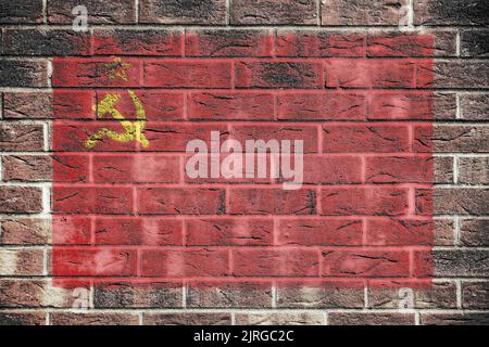 UdSSR-Flagge auf einem Backsteinmauer Hintergrund Stockfoto