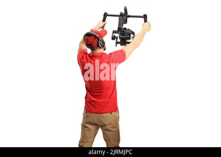 Rückansicht eines Kamerafunkers mit einem auf weißem Hintergrund isolierten Gimbal-Stabilisator Stockfoto