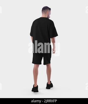 Übergroße schwarze Anzug Mockup auf einem Walking guy in Sneakers, Rückansicht, für Design, Muster, Werbung. T-Shirt Vorlage mit lockerer Passform, Shorts auf Mann, Stockfoto