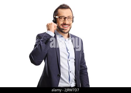 Männlicher Telefonhörer mit einem auf weißem Hintergrund isolierten Headset, das die Kamera anlächelt Stockfoto