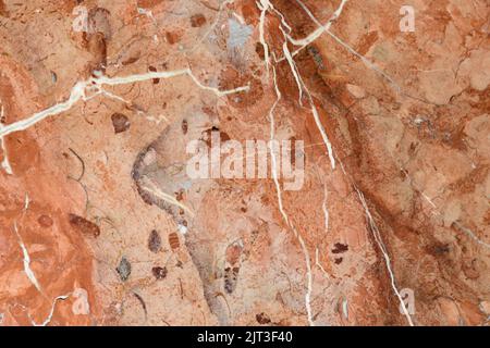 Alle de las betas de un suelo de mármol rojo Stockfoto