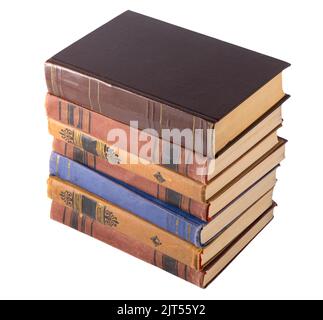 Stapel alter Bücher auf weißem Hintergrund isoliert. Bücherregal. Das Buch ist in einem Stoffbezug. Vintage-Bindung. Stockfoto