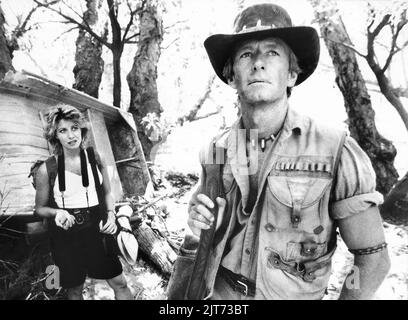 Linda Koslowski, Paul Hogan, am Set des Films, 'Crocodile Dundee', Paramount Pictures, 1986 Stockfoto