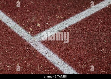 Gummierte Beschichtung für den Sport. Sportplatz Hintergrund. Draufsicht Stockfoto