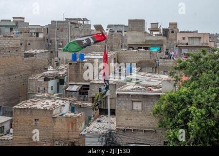 Karachi Korangi Straßen und öffentliche Verkehrsmittel und Fahrräder Stockfoto