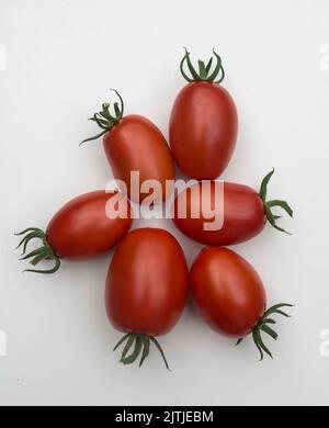 Crimson Plum F1 Tomaten Stockfoto