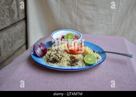 Kenianischer Pilau mit Hammelfleisch gekocht. Stockfoto