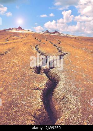 Eine vertikale Aufnahme von gebrochenem Boden gegen den wolkigen blauen Himmel und die Hügel. Stockfoto