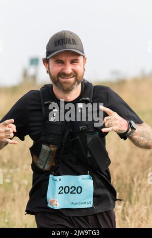 Läufer und Wanderer starten die South Coast Challenge bei für ihre ausgewählten Wohltätigkeitsorganisationen. Jeder Teilnehmer muss entweder eine 100km, 57km, 43km absolvieren. Stockfoto