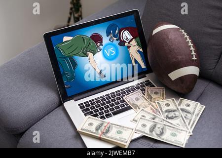 Fußball und Geld. Videospiel zu Hause Stockfoto