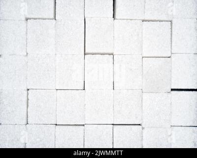 Textur von weißen Zuckerwürfeln in Nahaufnahme Stockfoto